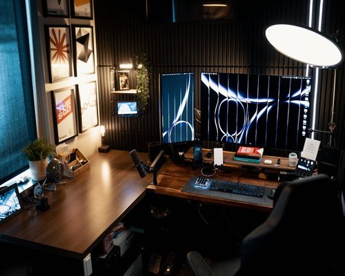 A well-arranged home office desk setup demonstrating proper physical distance from monitors